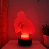 Veilleuse boxeur LED éclairée en bleu