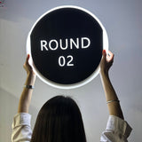 Panneau round de boxe lumineux vu de dos, anneau LED blanc