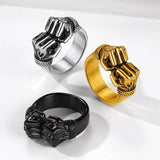 Bague boxe double poings en acier 316L : les trois finitions argent patiné, or et noir