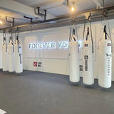Rail de guidage pour sacs de frappe