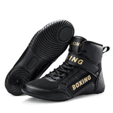 Chaussures de boxe noir et or, semelle noire à disque de pivot