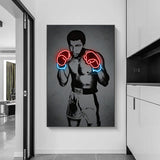 Tableau Mohamed Ali noir et blanc avec gants en effet neon rouge, affiche dans un salon