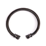 Bracelet jonc boxe finition noire, câble d'acier torsadé et embouts poings fermés