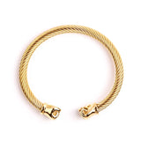 Bracelet jonc boxe finition or, câble d'acier torsadé et embouts poings fermés