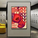 Tableau affiche Rocky vintage, gants rouges suspendus et lettrage repete, vue rapprochee de la toile