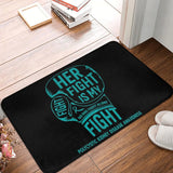Tapis gant de boxe turquoise posé sur un parquet