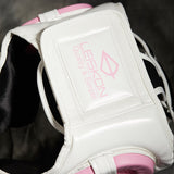 Arrière du casque de boxe femme : empiècement blanc et doublure filet noire