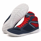 Chaussures de boxe bleu marine et rouge, semelle blanche