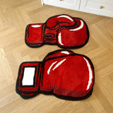 Tapis forme gant de boxe, la paire posée sur un parquet