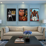 Tableau portrait Mohamed Ali en tons chauds avec deux scenes de carriere, affiche dans un salon
