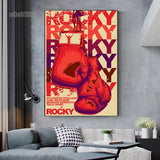 Tableau affiche Rocky vintage, gants rouges suspendus et lettrage repete, affiche dans un salon