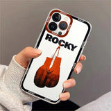 Coque iPhone Rocky Balboa, gants suspendus en aplat orange et silhouette bras levés incrustée, mention ROCKY en haut