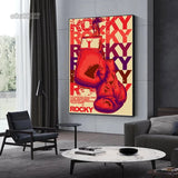 Tableau affiche Rocky vintage, gants rouges suspendus et lettrage repete, accroche dans une entree