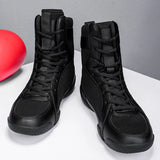 Chaussures de boxe noires, tige semi-montante, paire de face