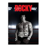 Tableau Rocky Balboa debout dans le ring, ceinture de champion a la taille, accroche dans une entree