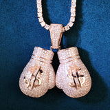 Pendentif gants de boxe dollar finition or rose, manchettes pavées à deux joncs polis