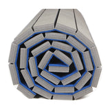 Tapis de sol Flexi-Roll enroulé pour le stockage