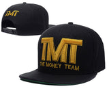 Casquette TMT noire et or à visière tissu, dessous vert