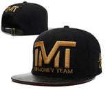 Casquette TMT noire et or à visière effet cuir
