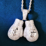 Pendentif gants de boxe dollar finition argentée, pavé de pierres jusque sur la bélière