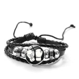Bracelet boxe à bouton pression, motif 1 : deux gants blancs face à face sur fond noir et blanc