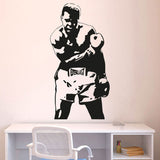 Sticker mural Mohamed Ali debout en pied posé au-dessus d'un bureau