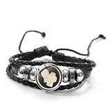 Bracelet boxe à bouton pression, motif 2 : un gant beige de profil sur fond noir cerclé d'or