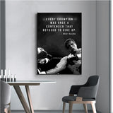Tableau citation Rocky Balboa et photographie de combat en noir et blanc, accroche dans une entree