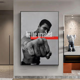 Tableau Mohamed Ali be the greatest, poing nu tendu vers l'objectif, bandeau rouge, affiche dans un salon