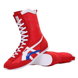 Bottes de boxe rouge, blanc et bleu, vue de trois quarts