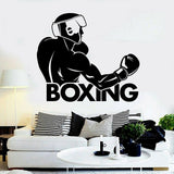 Sticker boxeur casque et lettrage Boxing posé au-dessus d'un canapé