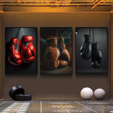 Tableau paire de gants de boxe noirs suspendue a des chaines metalliques, affiche dans un salon