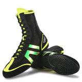 Chaussure de boxe noir et vert fluo et sa semelle noire à disques