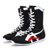Bottes de boxe noir et blanc en toile, bandes blanches et rouge