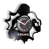Horloge vinyle boxe, motif boxeur déchirant le disque et lettrage BOXING