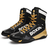 Chaussures de boxe vernies noir et or, lacets dorés