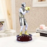 Statue de boxeur argent et doré en décoration d’intérieur