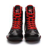 Chaussures de boxe vernies noir et rouge, paire vue de face
