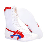 Botte de boxe blanche, rouge et bleu et sa semelle blanche