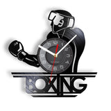 Horloge vinyle boxe, motif boxeur casqué au-dessus du lettrage BOXING