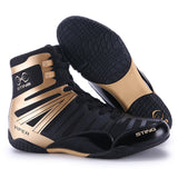 Chaussures de boxe Sting Viper noir et or et leur semelle noire