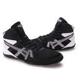 Chaussures de boxe noires et blanches, semelle noire à cinq pastilles de pivot blanches