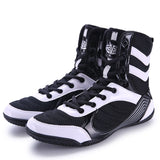 Chaussures de boxe noir et blanc à 3 bandes, la paire de profil