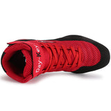Chaussure de boxe rouge vue de dessus, sangle et lacets rouges