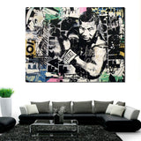 Tableau Mike Tyson en garde detoure sur collage de pages imprimees, format paysage, accroche dans une entree