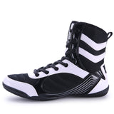 Chaussure de boxe noir et blanc, vue de profil et boucle de talon