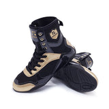 Chaussures de boxe noir et or, semelle noire nervurée