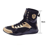Chaussure de boxe noir et or, hauteur de tige mesurée à 18 cm