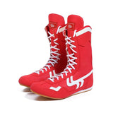 Bottes de boxe rouges à bandes blanches, semelle gomme caramel