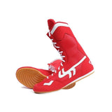 Bottes de boxe rouges et leur semelle gomme caramel nervurée